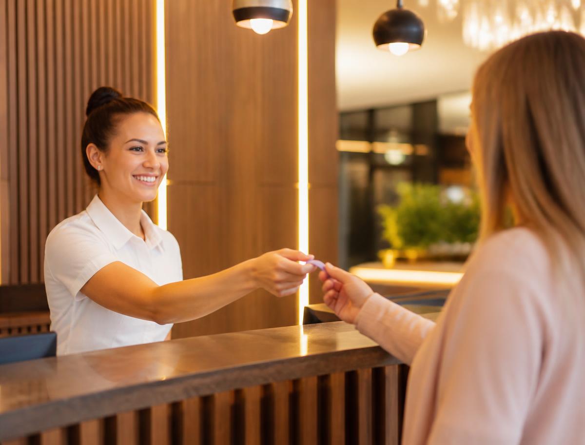 Hotel reception check-in with an RFID wristband Hotel reception check-in with an RFID wristband